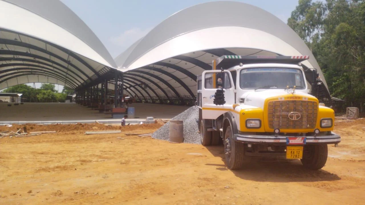 Curved architectural canopy and construction work in progress