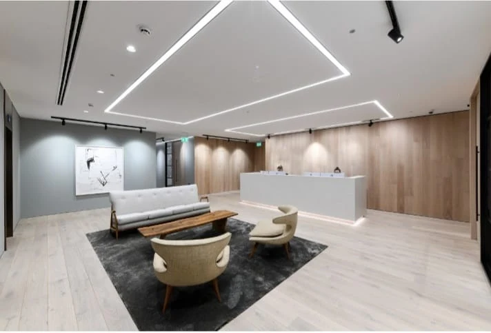 Finished interior lounge with timber wall panels and linear lighting